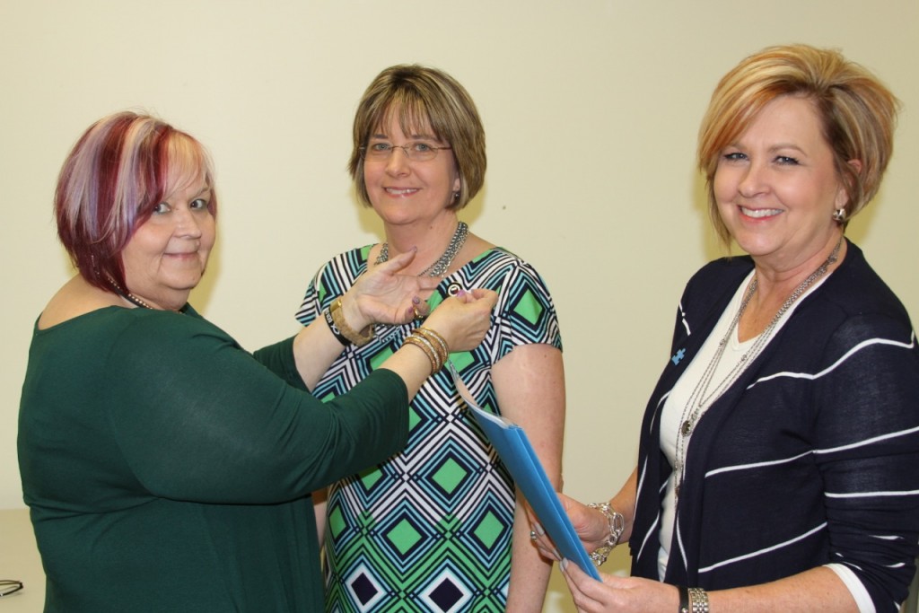 The 2016-2018 GFWC Grundy Woman's Club President was installed on April 4, 2016. Past President Bertha Street, left, pinned Glenna Owens during the installation ceremony, which was conducted by past Parliamentarian Tania Stephens, right.